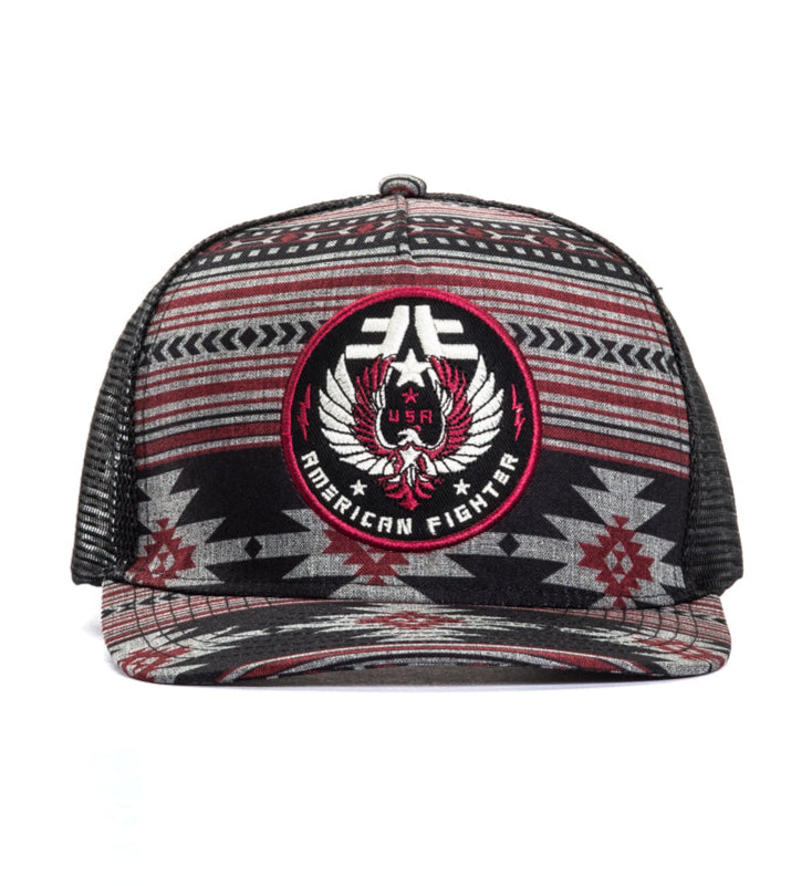 Trucker hat with geometric pattern and logo on a white background