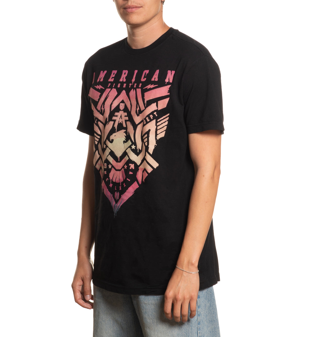 Person wearing a black t-shirt with a graphic design on a white background