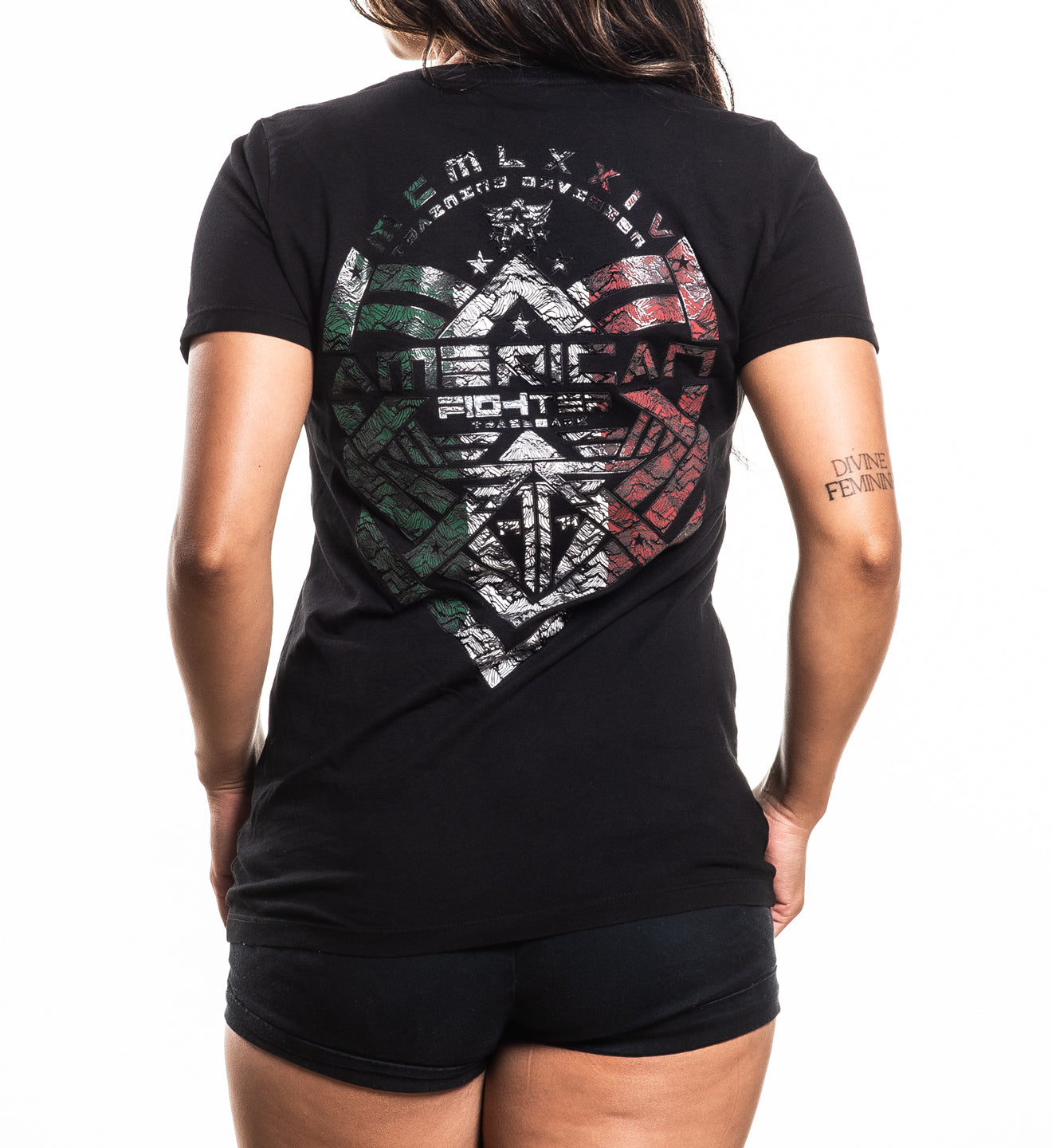 Person wearing a black t-shirt with a graphic design and text on a white background
